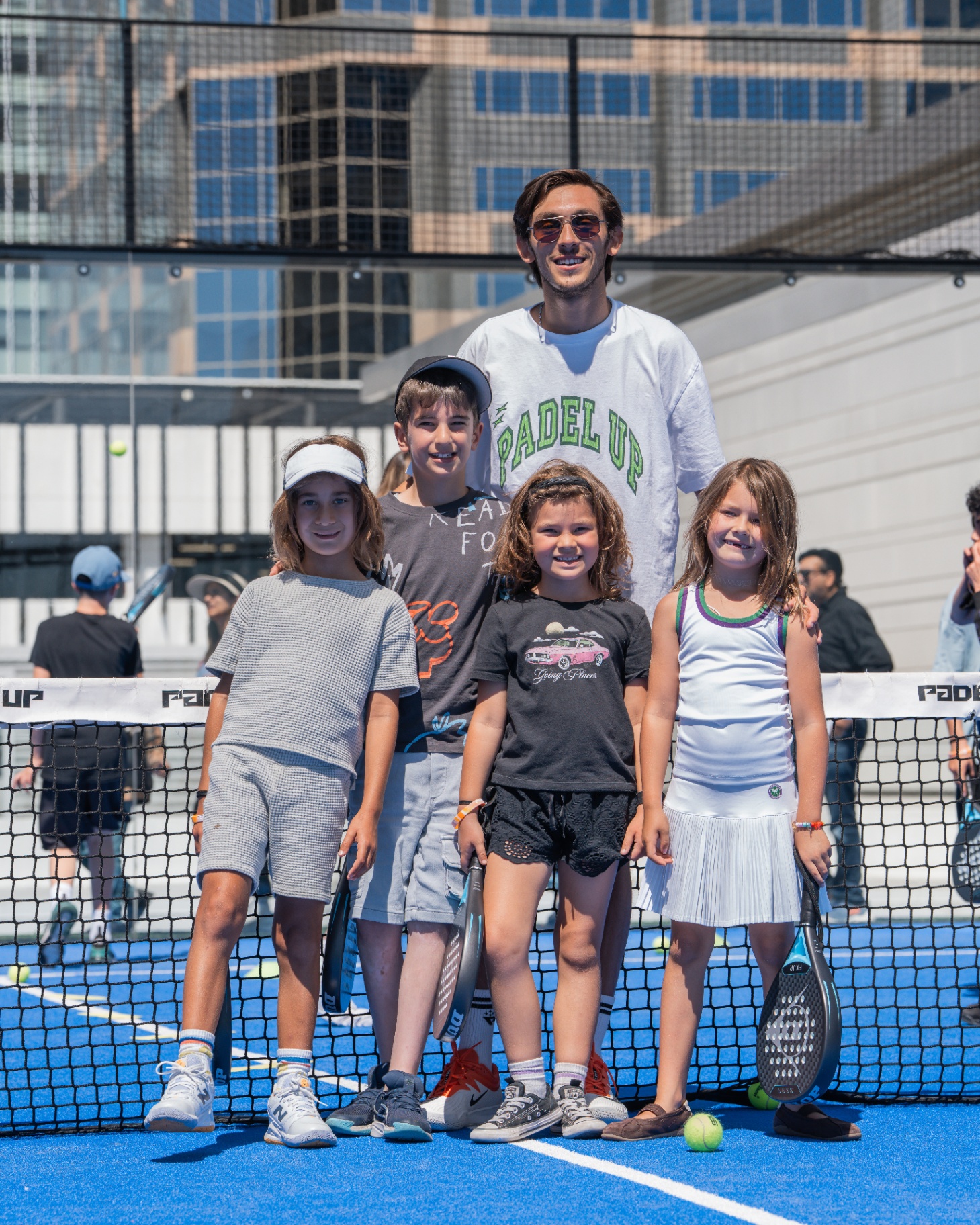 Junior players with their coach at Padel Up Century City