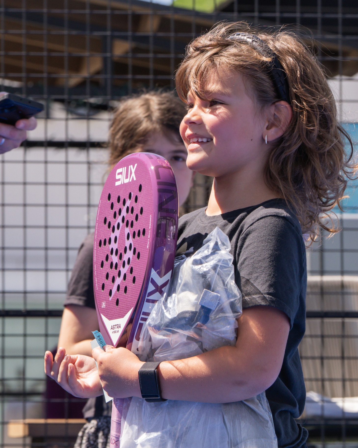 Young player holding her pink racket